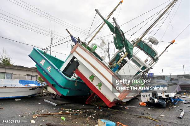 Fish boats are washed ashore after powerful Typhoon Lan hit past on October 23, 2017 in Futtsu, Chiba, Japan. Powerful Typhoon Lan left at least two...