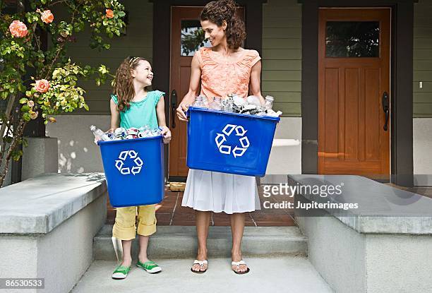 mother and daughter recycling - recycling bin stock pictures, royalty-free photos & images