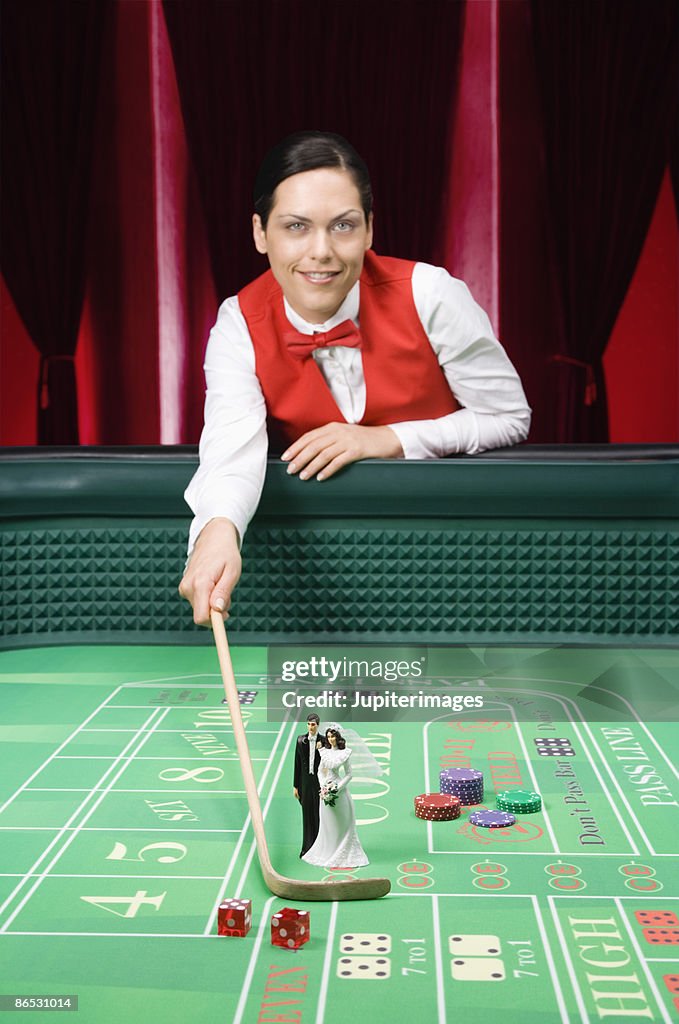 Wedding figurines on craps table