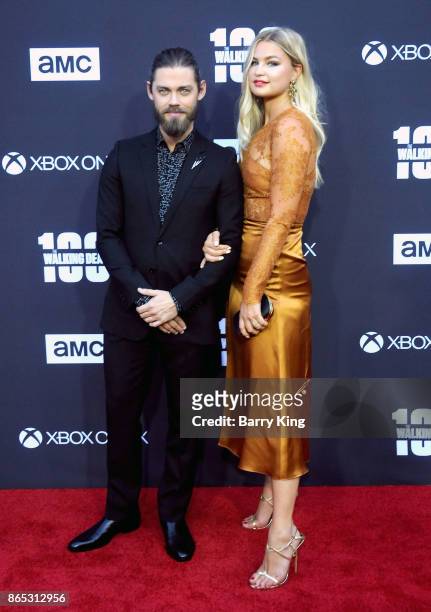 Actor Tom Payne and Jennifer Akerman attend AMC Celebrates The 100th Episode Of 'The Walking Dead' at The Greek Theatre on October 22, 2017 in Los...