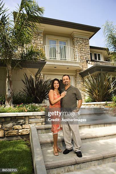 couple outside house - stereotypically upper class stock pictures, royalty-free photos & images