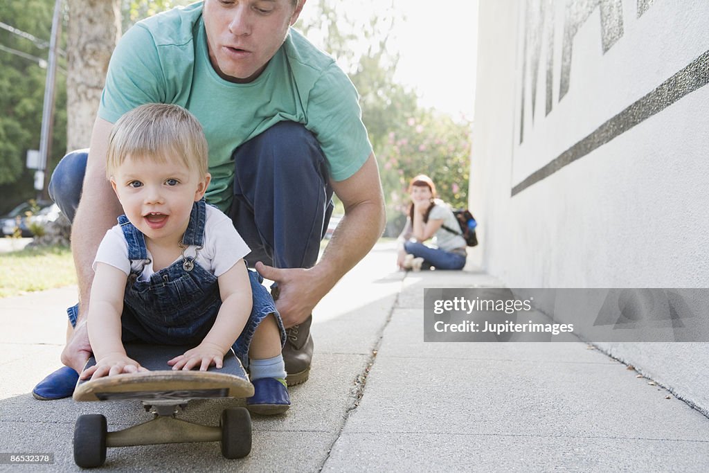 Father and son on skateboard
