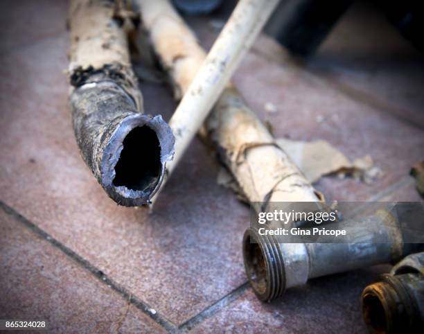 close-up of disconnected old lead pipe. - lead stock-fotos und bilder