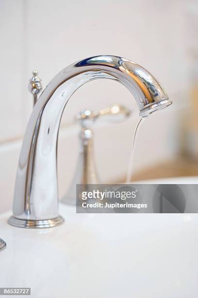 dripping faucet - triefen stock-fotos und bilder