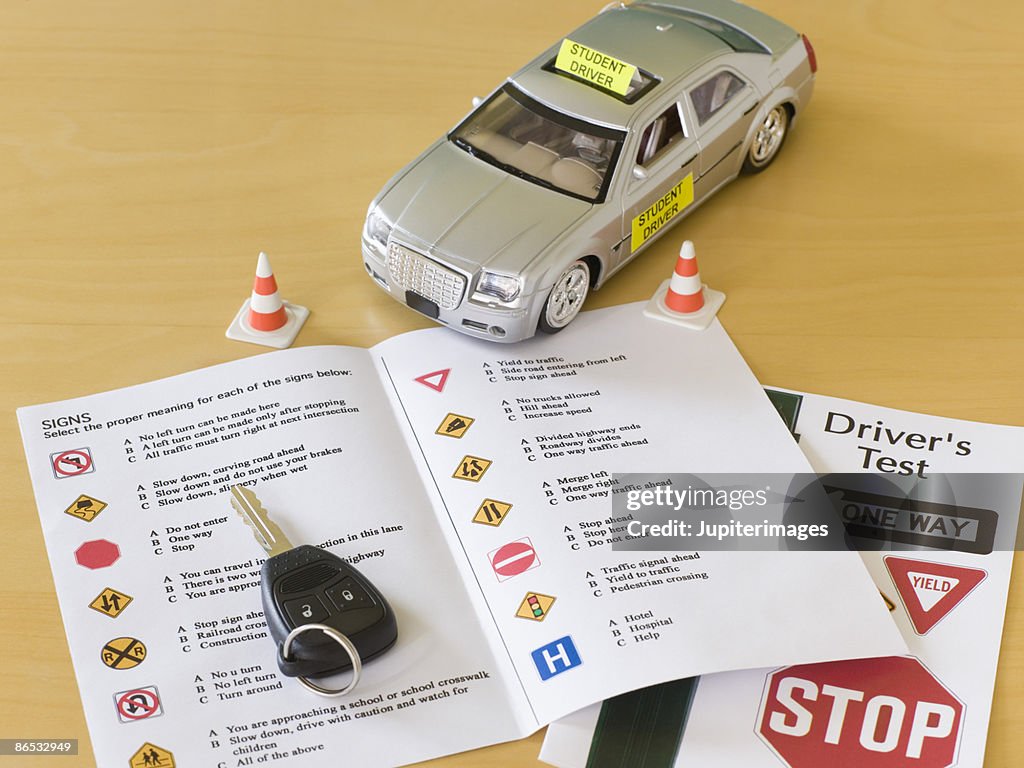 Toy car, car key, and driver's license test