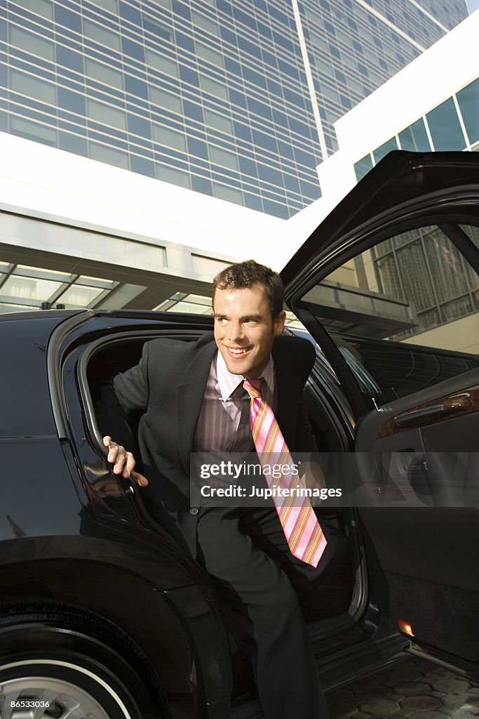 Man getting out of limousine