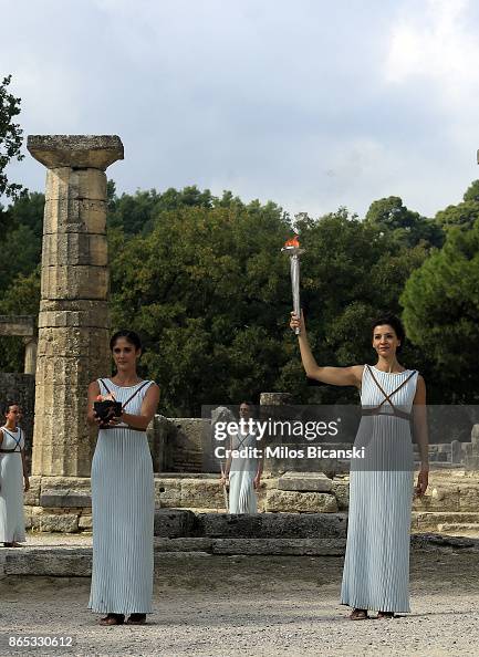 High priestess passes the Olympic flame at the Temple of Hera during ...
