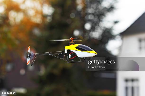 flying model helicopter - toy helicopter stock pictures, royalty-free photos & images