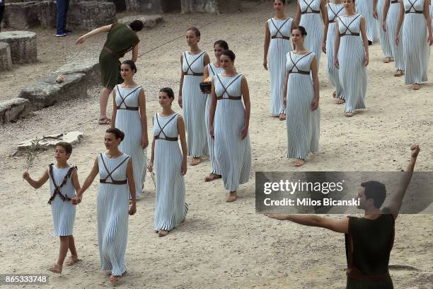 High priestess passes the Olympic flame at the Temple of Hera during a dressed rehearsal of the lighting ceremony of the Olympic flame in ancient...