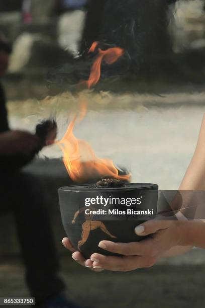 High priestess passes the Olympic flame at the Temple of Hera during a dressed rehearsal of the lighting ceremony of the Olympic flame in ancient...