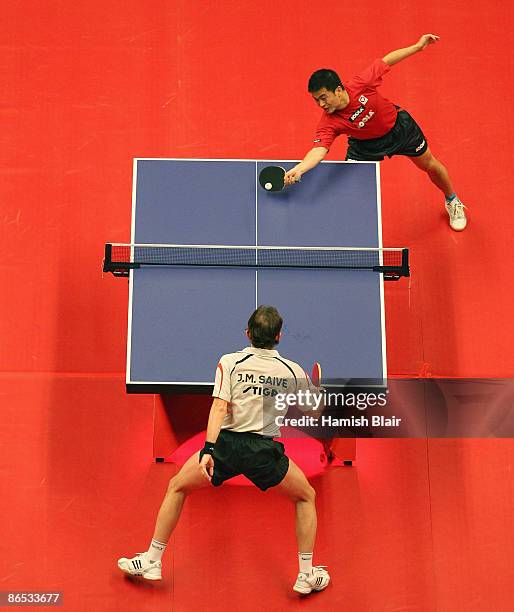 Chen Weixing of Austria in action during his quarter final match against Jean-Michel Saive of Belgium during the Table Tennis Masters at Royal Albert...