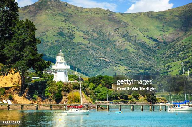 akaroa harbour scenery - akaroa stock pictures, royalty-free photos & images