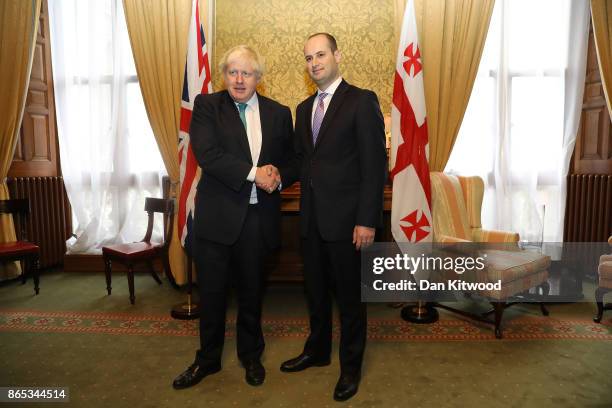 Britain's Foreign Secretary Boris Johnson greets Georgia's Foreign Minister Mikheil Janelidze at the Foreign and Commonwealth Office on October 23,...