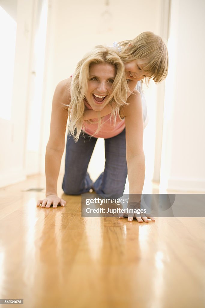 Playful mother and daughter