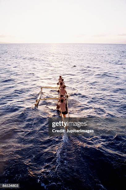 outrigger canoe on ocean - outrigger stock pictures, royalty-free photos & images