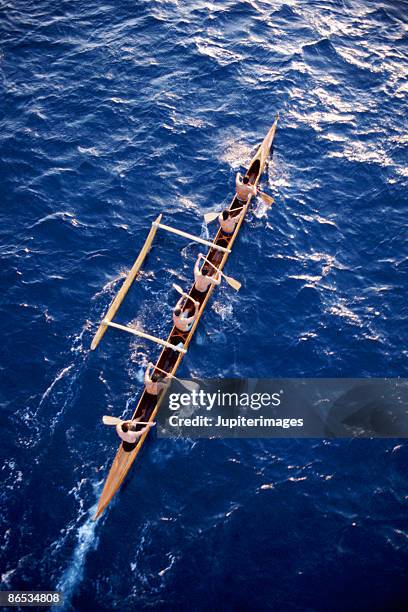 outrigger canoe on ocean - outrigger stock pictures, royalty-free photos & images