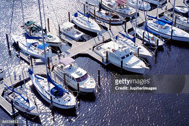 aerial view of boats in marina - marina stock pictures, royalty-free photos & images