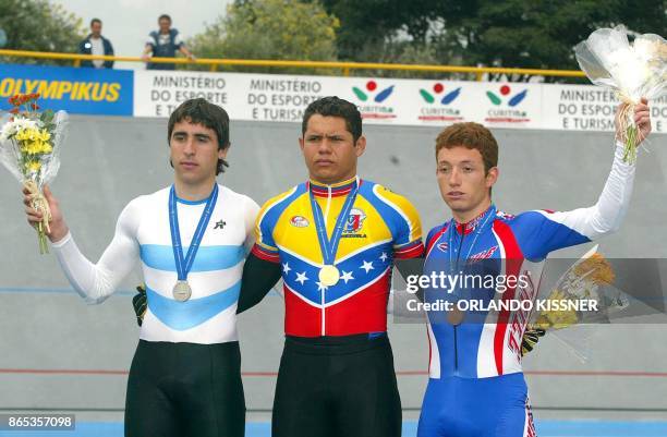 Cyclist and gold medal winner Alexander Cornieles from Venezuela, poses at the podium with silver medal winner Maximiliano Richeze , from Argentina...