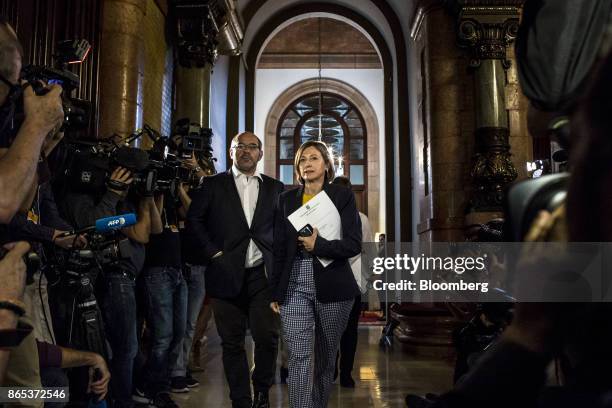 Carme Forcadell, Catalonia's parliament president, center, arrives for a meeting inside the Generalitat regional government offices in Barcelona,...