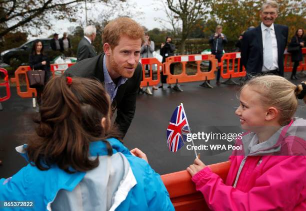 Prince Harry meets local school children during his visit to St Michael's on Wyre village hall on October 23, 2017 in St Michael's on Wyre, England.