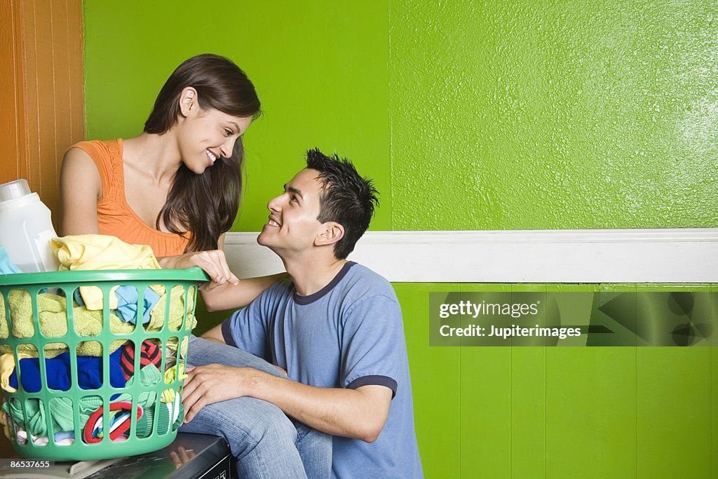 Couple with laundry basket