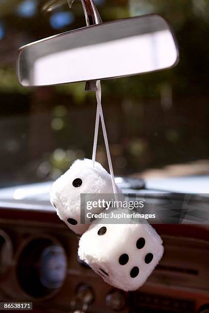 Fuzzy Dice On Rearview Mirror Stock-Foto - Getty Images