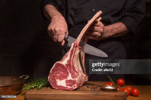 chef cutting beef - meat raw stock pictures, royalty-free photos & images