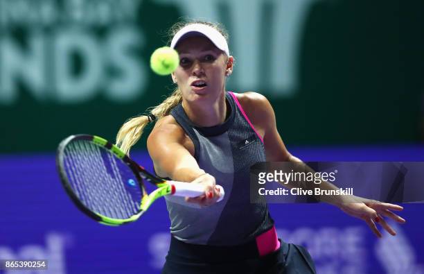 Caroline Wozniacki of Denmark plays a forehand in her singles match against Elina Svitolina of Ukraine during day 2 of the BNP Paribas WTA Finals...