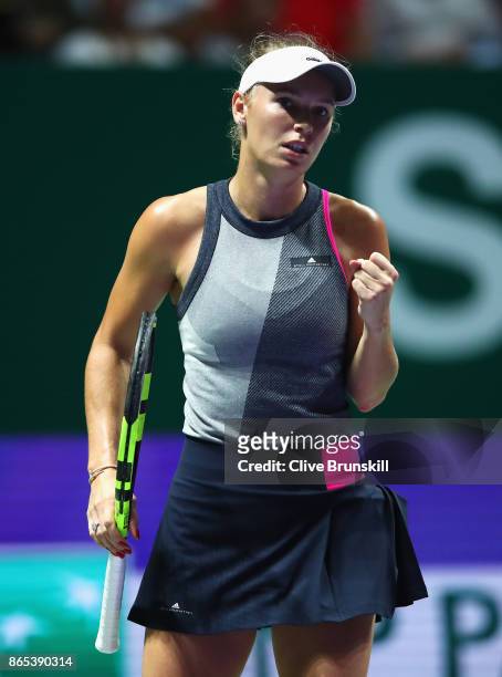 Caroline Wozniacki of Denmark celebrates a point in her singles match against Elina Svitolina of Ukraine during day 2 of the BNP Paribas WTA Finals...