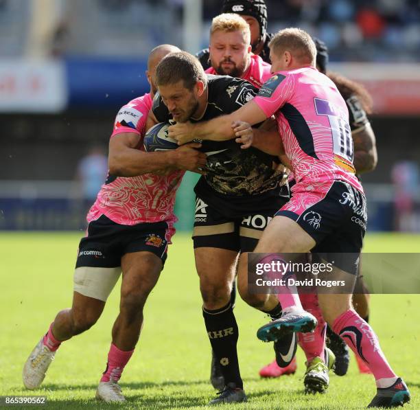 Francois Steyne of Montpellier is tackled by Olly Woodburn (L0 and Gareth Steenson during the European Rugby Champions Cup match between Montpellier...