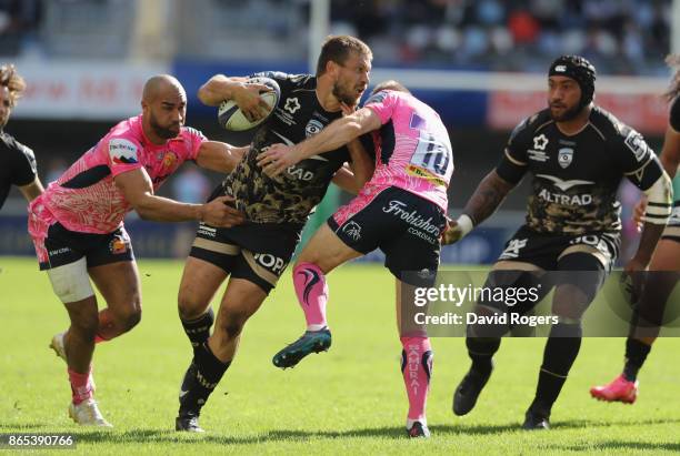 Francois Steyne of Montpellier is tackled by Olly Woodburn