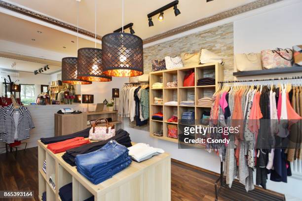 interior of a store selling women's clothes and accessories - womenswear stock pictures, royalty-free photos & images