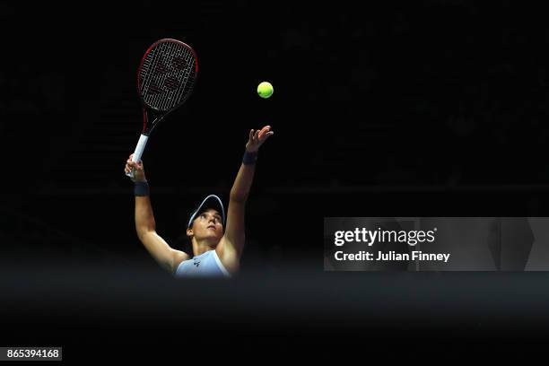 Caroline Garcia of France serves in her singles match against Simona Halep of Romania during day 2 of the BNP Paribas WTA Finals Singapore presented...