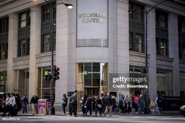 Pedestrians pass in front of a TD Ameritrade Holding Corp. Location in downtown Chicago, Illinois, U.S., on Thursday, Oct. 19, 2017. TD Ameritrade...