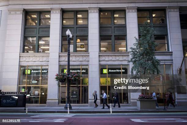 Pedestrians pass in front of a TD Ameritrade Holding Corp. Location in downtown Chicago, Illinois, U.S., on Thursday, Oct. 19, 2017. TD Ameritrade...