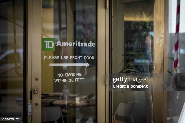 Signage is displayed on the door of a TD Ameritrade Holding Corp. Location in downtown Chicago, Illinois, U.S., on Thursday, Oct. 19, 2017. TD...