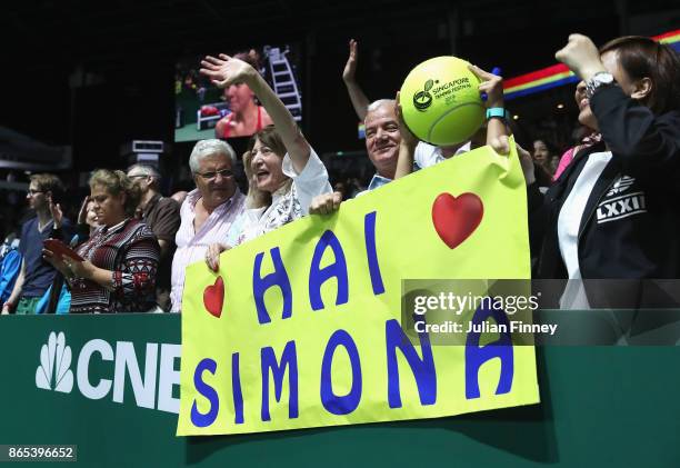 Simona Halep fans celebrate after her victory in the singles match against Caroline Garcia of France during day 2 of the BNP Paribas WTA Finals...