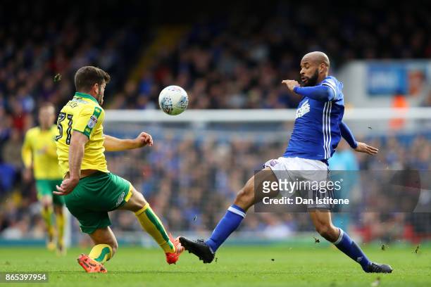 David McGoldrick of Ipswich Town battles for the ball with Grant Hanley of Norwich City during the Sky Bet Championship match between Ipswich Town...