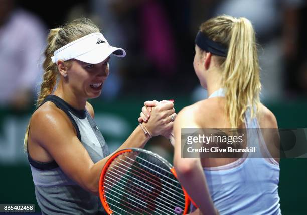 Caroline Wozniacki of Denmark shakes hands with Elina Svitolina of Ukraine after her victory in their singles match during day 2 of the BNP Paribas...