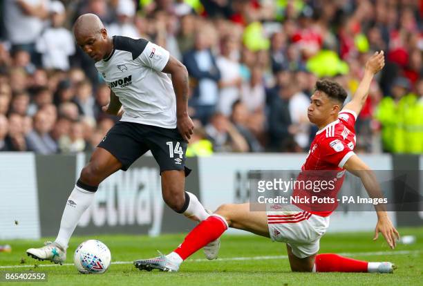 Derby County's Andre Wisdom and Nottingham Forest's Tyler Walker battle for the ball