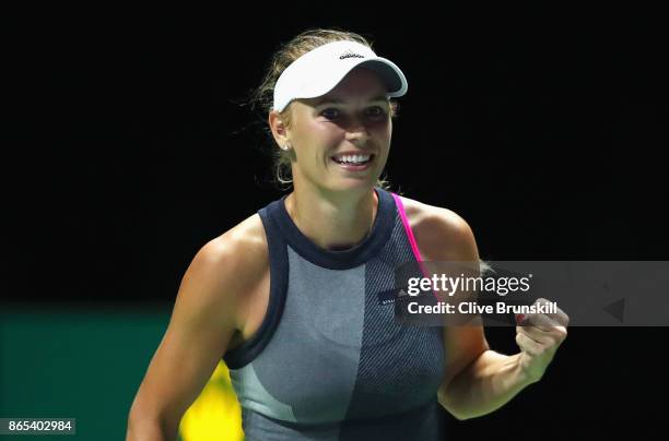 Caroline Wozniacki of Denmark celebrates victory in her singles match against Elina Svitolina of Ukraine during day 2 of the BNP Paribas WTA Finals...