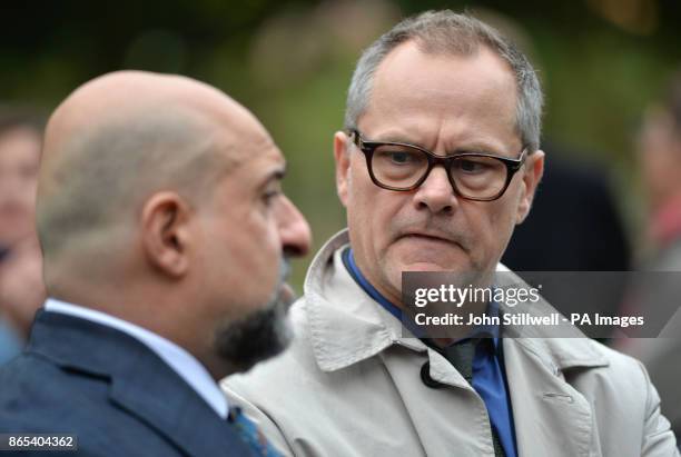 Omid Djalili and Jack Dee at the funeral of comedian Sean Hughes at Islington and Camden Cemetery in London.