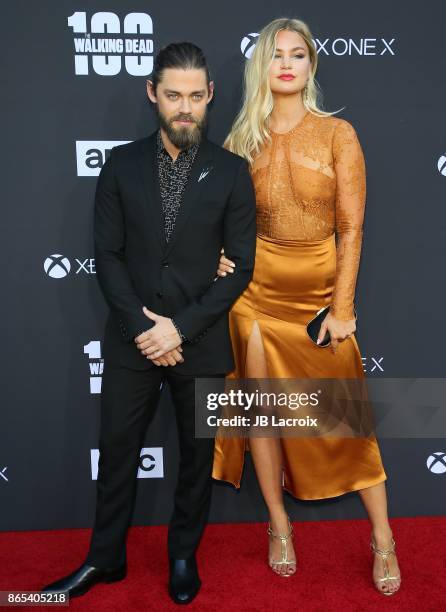 Tom Payne and Jennifer Akerman attend the 100th episode celebration off 'The Walking Dead' at The Greek Theatre on October 22, 2017 in Los Angeles,...