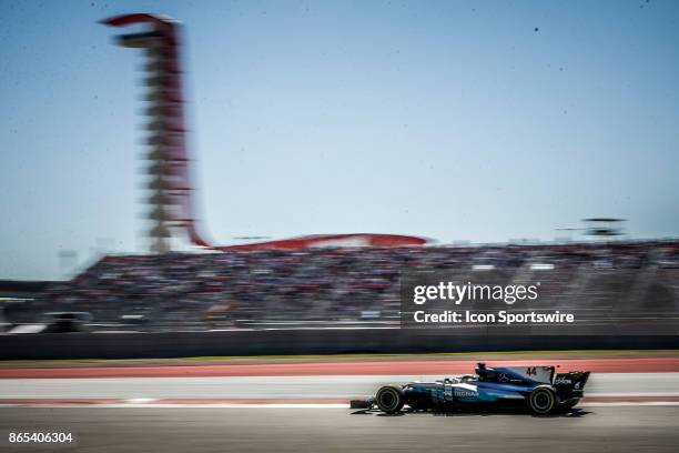 Mercedes driver Lewis Hamilton of Great Britain drives towards turn 13 with COTA tower in background during the Formula 1 United States Grand Prix on...