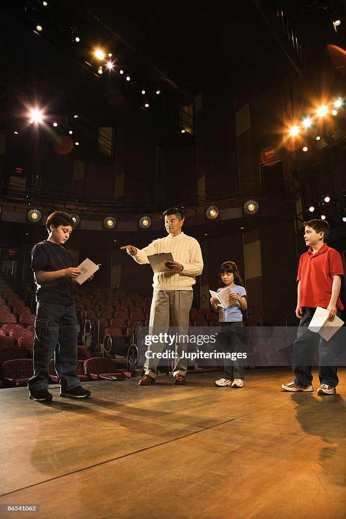 Student Play Example Man And Students Practicing A Play High-Res Stock Photo - Getty Images