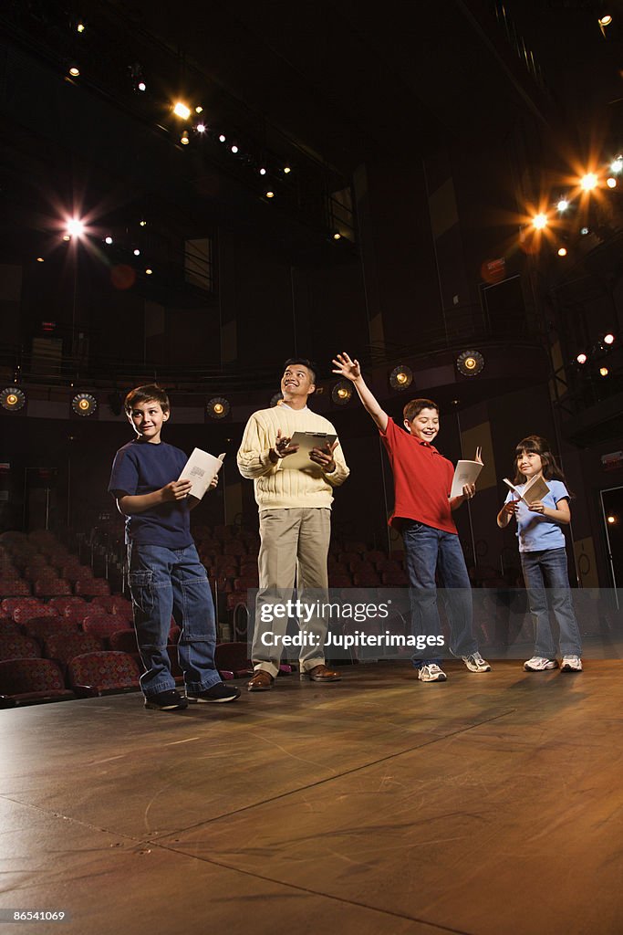 Student Play Example Man And Students Practicing A Play High-Res Stock Photo - Getty Images