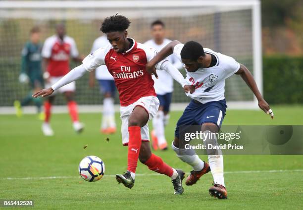 Aaron Eyoma of Arsenal takes on Japhet Tanganga of Tottenham during the match between Tottehma Hotspur and Arsenal on October 23, 2017 in Enfield,...