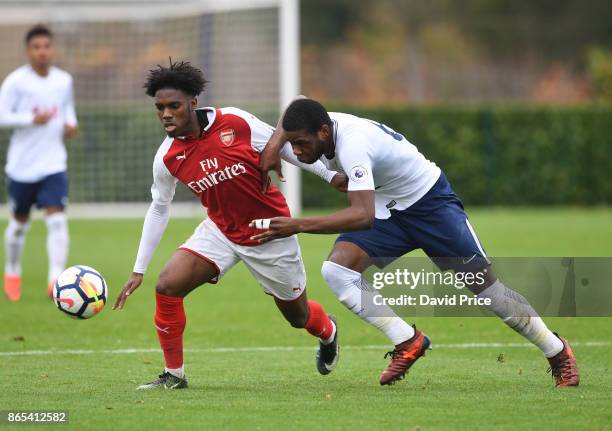 Aaron Eyoma of Arsenal takes on Japhet Tanganga of Tottenham during the match between Tottehma Hotspur and Arsenal on October 23, 2017 in Enfield,...