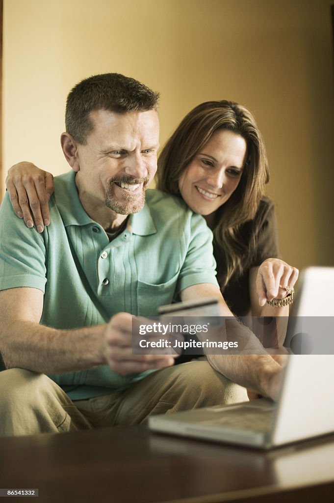 Couple using laptop computer