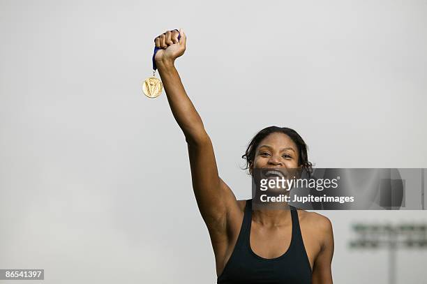 victorious woman - blank gold medal stock pictures, royalty-free photos & images